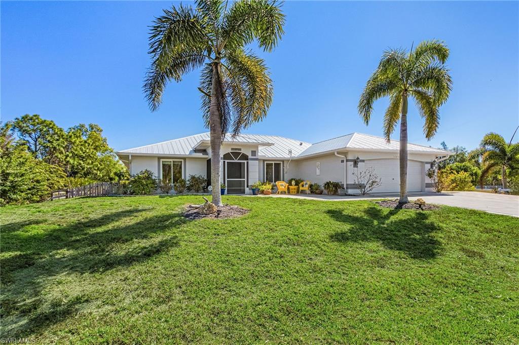 Beautiful Pool home with 2 car garage PLUS detached 20 x 24 building.  Massive lanai and outdoor living space. This location is extremely sought-after because it is located in flood zone X and flood insurance should not be required by your lender, PLUS this home has never flooded.  Enjoy the bright updated  kitchen, large laundry room, and generous living spaces filled with natural light. Outdoor living shines with a solar-heated and electric pool and a fully fenced yard providing privacy and room to roam. A standout feature is the detached, 20 X 24  air-conditioned building — perfect for a workshop, man cave, craft room, fitness space, or home office. The main garage also includes a mini-split A/C system for added comfort. A large 12 X 16 shed provides additional storage. RECENT UPGRADES & IMPROVEMENTS INCLUDE:
New Metal Roof (2023)
Whole-House Generator (2023)
New Impact Windows
New Electrical Panel
Solar Electric Charging System Lease (No Leak Guarantee)
Whole-House Water Filtration & Reverse Osmosis System
New Gas Range & Microwave
Two New Refrigerators
New Maytag Washer & Dryer
Mini-Split A/C in Garage
Pool Cage Re-Screened with Super Screen
Accordion Shutters on Lanai
Fully Fenced Yard
Centrally located with plenty of spots to drop your boat in, you’ll be just minutes from world-class fishing, waterfront dining, art galleries, and beautiful natural surroundings. This property offers the perfect blend of privacy, modern updates, and relaxed island living. Schedule your private showing today. NOTE: OPPORTUNITY TO PURCHASE THE LOT NEXT DOOR (FROM SEPARATE SELLER)  FOR A FULL ACRE OF PROPERTY!!