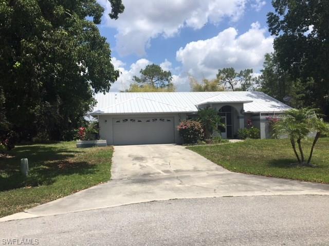 Open, Spacious, Bright, Private  and Comfortable home at the end of a Cul-D-Sac street with lovely views of a closed golf course in the rear. The screened n rearLanai- Pool area is surrounded by Bamboo and other trees and shrubs in which it provides even more privacy for the rear outside pool area, and deck  where most of your living will be done.
Interior mostly tiled , and modern contemporary style design, spacious garage with a long driveway at the end of the dead end street.  Excellent Family Home or Excellent home for someone or ones  in need of privacy and space, 
Hurricane windows and doors (except for the lanai slides) , Newer Metal Roof , All tiled