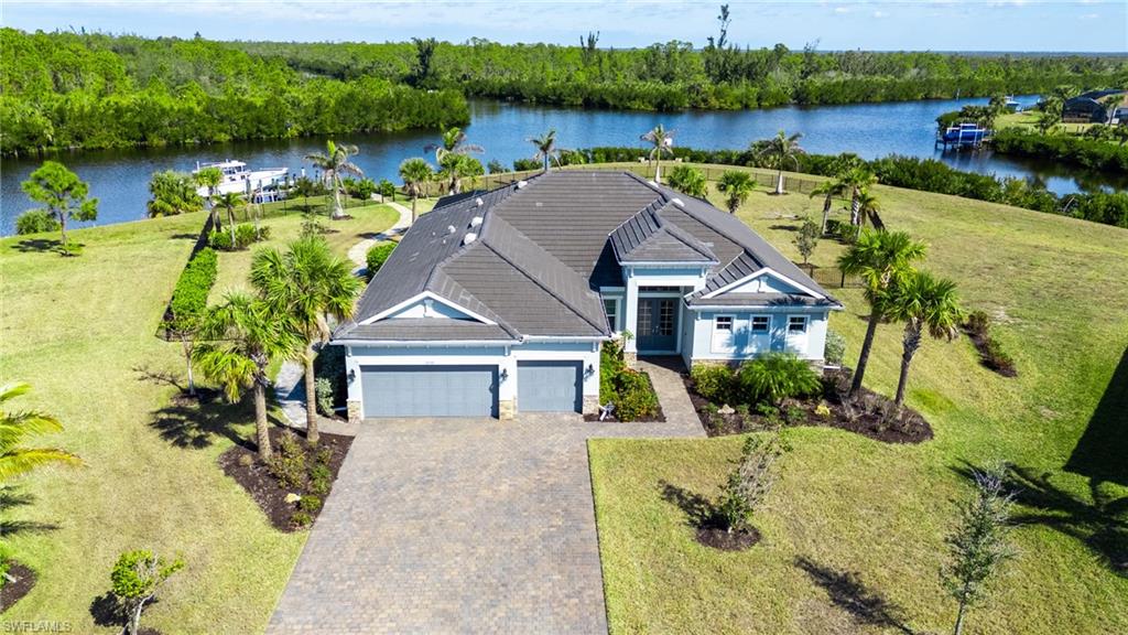 This home is a true gem in South Gulf Cove! Nestled on the largest lot in Harbor West, situated on over one acre, it has sailboat water access, making it a boater's paradise. Built in 2021, this unique Lennar built Sunset model is located in the exclusive, gated community of Harbor West, the only master-planned and gated community in South Gulf Cove. The home boasts a coastal design with 3 bedrooms, 3 bathrooms, and a den that can serve as a fourth bedroom. With 275 feet of water frontage, the property features a 90-foot extended paver walkway leading to a 14,000 lb boat lift and a maintenance-free composite dock. Inside, the formal foyer opens to a spacious living room with a custom-built entertainment center and electric fireplace. The kitchen is a chef's delight, with solid wood 42” cabinets, a built-in oven and microwave, an electric cooktop, a pot filler, a vented hood, and a farmhouse sink. The large center island with quartz countertops and bar seating connects to the breakfast nook with a picture window. The luxurious owner's suite includes tray ceilings, his and her walk-in closets, dual vanities, quartz counters, and an oversized tiled shower, with direct access to the lanai and pool area. The laundry room is equipped with wood cabinets, a utility sink, and sleek barn doors. Outdoor living is a dream with panoramic water views, a clear view lanai screen, a heated saltwater pool and spa, and a fully equipped outdoor kitchen and bar. The home is packed with upgrades, including shiplap, board & batten, barn doors, 8’ interior doors, coffered ceilings, crown molding, and smart home readiness. Additional features include an irrigation system, security camera system, tile roof, outdoor paved fire pit, and aluminum pergola.
Live the extraordinary coastal lifestyle in this gated community with access to over 55 miles of boatable waterways. Enjoy the privacy and fabulous Florida weather. Port Charlotte offers some of the best swimming, boating, kayaking, and fishing in Southwest Florida. Your tropical oasis awaits!