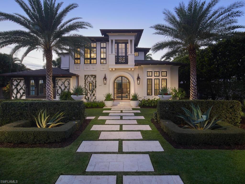 Located in the heart of Old Naples on a quiet street, this incredible opportunity awaits. Completed in 2020, this custom home by London Bay showcases unrivaled finishes and meticulous details designed by Romanza Interior Design, executed to the highest level of quality. The timeless eclectic architecture features eye-catching elements such as an arched glass front door, a faux Juliet balcony, thoughtfully placed medallions, copper gutters, gas-lit lanterns, and a mitered tile roof all complemented by the flawless landscape. Venetian plaster adorns the entire first floor, which features a beautifully designed kitchen, a butler's pantry with a wet bar, a spacious great room, and a formal dining area, all enhanced by custom built-ins. The spectacular primary suite provides direct access to the rear yard and includes two walk-in custom closets, along with a bathroom finished in luxurious materials. On the second floor, you will find two bedroom suites, a study that can serve as additional sleeping space, and a loft that leads to a spacious covered balcony. Step outside to discover a true oasis, complete with casual seating, a dining table under a well-lit trellis, and an intimate fire pit area surrounded by beautiful landscaping and stunning features in vibrant colors. Additional noteworthy features include automated shutters and screens, elevated generator and air-conditioning units, tankless water heaters, and an air-conditioned garage equipped with a car lift. The property also boasts a storage closet off the garage and the convenience of natural gas service. This home must be seen to fully appreciate the exceptional attention to detail. Sustained no damage during any recent storms and is conveniently located in close proximity to the beach and all that downtown Naples has to offer.