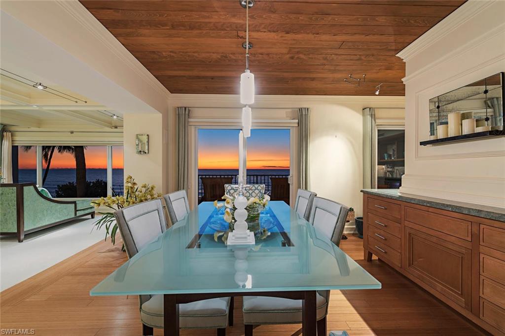This IS living on the beach in Naples! Move-in ready and fully furnished … stunningly timeless design … the sounds of the beach … wind through the palm trees … and oh those sunsets over the Gulf of Mexico. These authentically beachfront residences at Laurentians are singularly extraordinary. Overlooking the beach through the picture windows & sliding glass doors in the kitchen, dining room, living room & master suite areas is the epitome of beachfront living ... a joy anytime. Double crown mouldings, coffered ceiling with tech lighting,  side-by-side wood paneled double Subzero refrigerator uppers & freezer drawers below, coffee station, wine cooler, double ovens, den area can also serve as family room, gorgeous island in kitchen, separate balconies off master suite & living areas … & so much more. Laurentians offers awesome proximity to the downtown shopping & dining districts while convenient to whatever shopping for day-to-day needs you may have. This southwest corner residence is a knockout, fantastic floor plan, garage parking under the building. Whatever you think of the terrific photos, be prepared to be even more delighted when you view this beachfront residence in person!