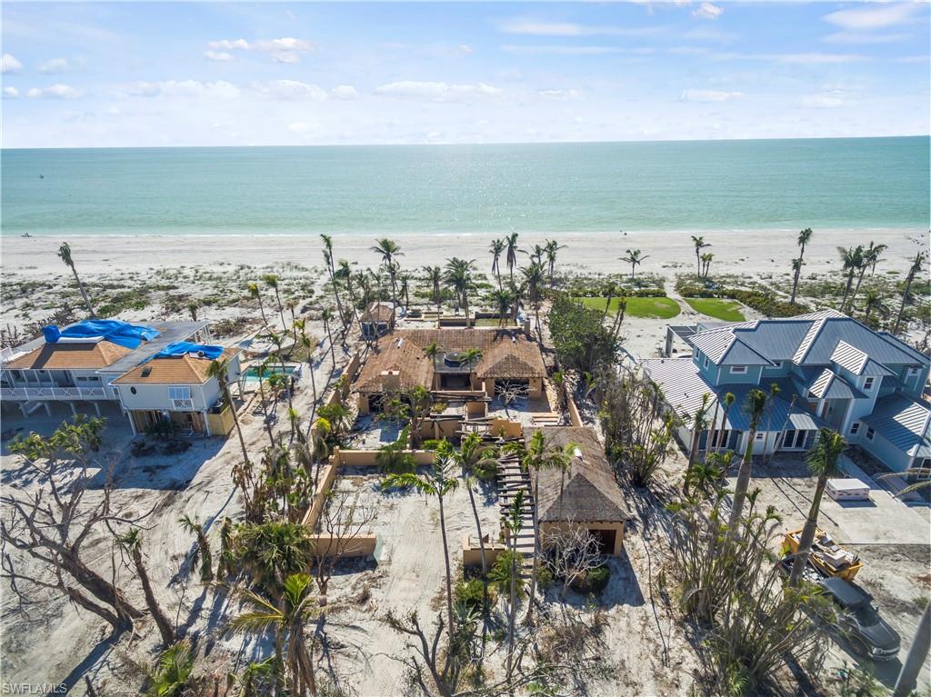 Your Sanibel Gulf Front Home Dreams Begin Here! Located on exclusive Waters Edge Lane, you will find this nearly 1 acre Gulf front estate. The property presents a great opportunity to potentially rebuild the existing structure consisting of a Main House, separate Poolside Cabana, Grand Lanai / Pool area and Tropical Gardens with lily pond. Or your choice might be to clear the property and start new. The existing structure provides some of the closest views of the Gulf of Mexico and is just steps to Gulf Shores wide, white sandy beaches. The Sunset views are breathtaking in this serene setting. This is an opportunity not to be missed.