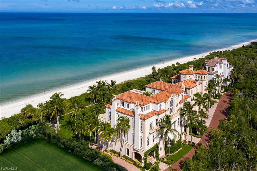 Directly on the sugary sand of the Gulf of Mexico and a short beach walk to the Bay Colony Beach Club, this “Castle by the Sea” is where your dream awaits. Nearly a full acre of beachfront property and situated within the exclusive Strand gates, this is a true opportunity to own a bit of paradise. Masterfully constructed by BCB Homes, this four-story estate captures the view from nearly every space with copious amounts of glass showcasing the turquoise waters beyond. Luxurious bedrooms complete with fireplace for nearly every guest, a master suite with sweeping sunset views and a remarkable outdoor space creates the perfect atmosphere for family and friends to come together and enjoy what Naples has to offer. Custom millwork throughout, soaring ceilings, gourmet kitchen, 4-car garage and multiple balconies with unsurpassable views are just a few details which bring the Castle by the Sea to life. Accessible only after passing through a second electronic security gate, The Strand at Bay Colony offers the ultimate in privacy and exclusivity.