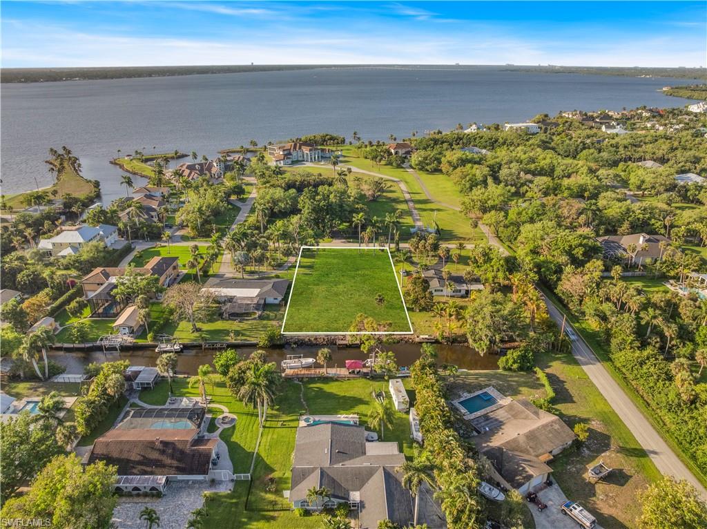 SIGHT PLANS AND RENDERINGS ARE IN SUPPLEMENTS~ Welcome to a rare opportunity to build your dream home on one of the most desirable waterfront properties in North Fort Myers. Located at 62 Wolcott Drive, this oversized 0.59-acre parcel is currently the LARGEST waterfront lot on the market in the area, offering unmatched space, privacy, and DIRECT ACCESS to Southwest Florida’s premier boating lifestyle. 120 FEET of DIRECT Gulf ACCESS Water Frontage. A true MILLION DOLLAR - Boating & Fishing Community. This lot is CLEARED and BUILD_READY, featuring a brand-new SEAWALL + DOCK , and walkway (a rare upgrade that required two years for Army Corps approval), saving you significant time and expense. Even better, no pilings are required (geotechnical report available), making your future build faster and more cost-efficient. PLANS AND PERMITS are already AVAILABLE for a stunning Mediterranean-style home.  Wide water frontage provides ample space for a dock, boat lift, or larger vessel. Conveniently located just minutes from Pine Island Road shopping and dining, Downtown Fort Myers, and approximately 5 minutes to Legacy Harbour Marina (scheduled to reopen May 2026). Surrounded by upscale waterfront homes, this neighborhood offers strong long-term value and an exceptional lifestyle for full-time residents, seasonal owners, or investors.
