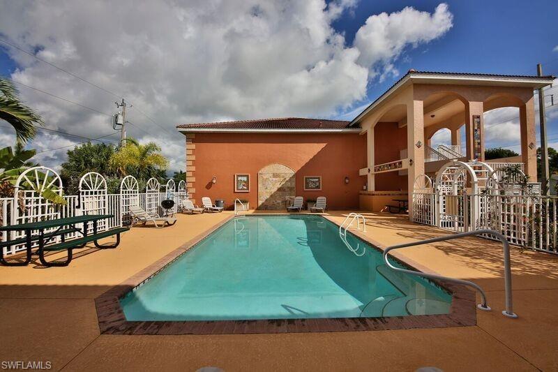 2007 construction, 2nd floor large 2/2, small exclusive 19 unit bldg (nearly 1390 sq. ft includes lanai per appraisal), washer/ dryer, granite counters, crown molding, split bedrooms for privacy, tile and carpet flooring, lots of storage and closets, master bath has tub/ walk in shower, sparkling pool, BBQ grills, tile murals, Spanish tile roofs, lush landscape, covered parking plus guest parking, hurricane windows, quality construction. Great Community Pool for your summer enjoyment.