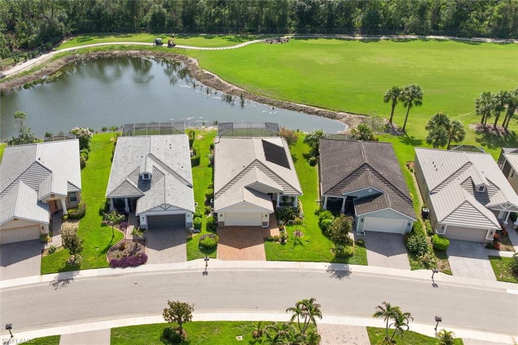 Perfectly positioned near the end of a quiet cul-de-sac, this beautifully maintained pool home sits on an oversized pie-shaped lot with an extra-wide backyard, offering panoramic views of the lake, golf course, and naturally wooded area for exceptional privacy and scenery.

The open-concept floor plan features tile flooring throughout the main living areas, wood flooring in the flex room, and plush carpet in the bedrooms. Plantation shutters add timeless appeal, while the flex room closet includes professionally installed removable custom shelving for added versatility.

The air-conditioned Florida room offers additional living space with interior shades and electric roll-down shutters. Four pocketing sliding glass doors create a seamless transition to the screened lanai and saltwater pool, which features both electric and solar heating for year-round enjoyment.

The garage is equipped with heavy-duty shelving, attic flooring for additional storage, a dedicated electrical circuit and breaker for appliances, and a generator outlet with an exterior concrete pad.

Recent updates include a Rheem HVAC system, water heater, refrigerator, microwave, garbage disposal, and kitchen faucet. Additional exterior features include decorative landscape curbing, full-house gutters, and accordion storm shutters on the rear of the home.

Residents of Magnolia Landing enjoy resort-style amenities including a pool, lap pool, fitness center, pickleball, bocce, and shuffleboard. HOA dues include HD cable, landscaping, irrigation, on-site management, and more for easy, low-maintenance living. Optional memberships are available for the 18-hole Championship Golf Course, golf shop, and on-site restaurant.

Conveniently located just minutes from shopping, dining, downtown Fort Myers, and Punta Gorda, this exceptional home offers the perfect blend of breathtaking views, thoughtful upgrades, and the Southwest Florida lifestyle.
