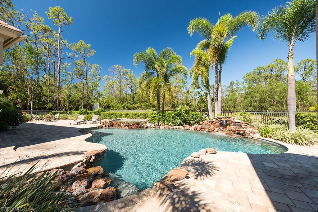 Nested on a secluded 2.5 acre lot, minutes away from the beach and everything Naples has to offer, this will be your very own Private Resort Residence! The Estate is an entertainer's dream & is sure to impress from the moment you walk through the front doors. Framing the formal dinning & living rooms are floor to ceiling windows overlooking your private oasis. The outdoor living room has two siting areas, TVs & a stunning stacked stone fireplace. Adjacent to it is a full outdoor kitchen, which will allow your to enjoy the indoor and outdoor lifestyle to its fullest. The kitchen, although not visible from the formal areas, is the heart of your family's casual living areas! The master bedroom quarters leave nothing to be desired. With its own foyer, sitting area, breathtaking views & a spa like master bathroom, this will be your sanctuary! In addition to the well appointed first floor guest suite, the third & fourth bedrooms, as well as the loft, are upstairs granting your guest - or kids - their own space. With a sunlit deck, a resort style pool, your very own baseball diamond & plenty of room, this will be the background of your family's future memories.