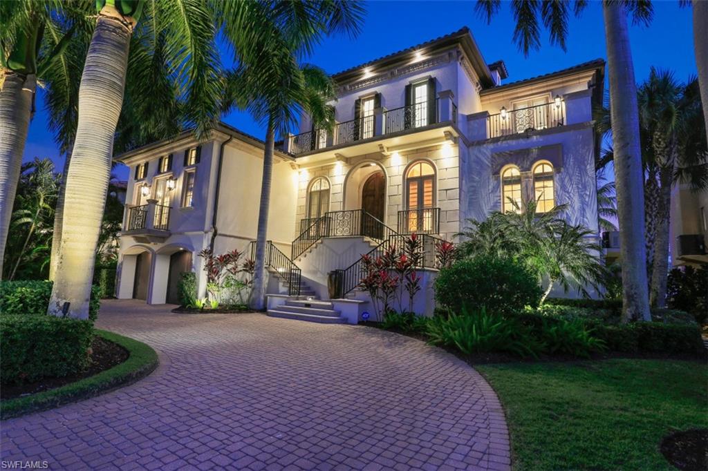 Elegant masterpiece, recently updated in 2017 with upgrades worth over $1 million, it's a dream for anyone who appreciates quality, elegance, fine details and open spaces.
Nestled on one of the most sought after 3 prestigious streets off Gulf Shore Drive, this private retreat boasts 5 bedrooms, 7 bathrooms, a professional grade kitchen, wine cellar, billiard room, an open great room concept and premiere luxury finishes throughout the residence including beautiful travertine flooring, crown molding, boiserie, as well as, high and coffered ceilings.
This luxurious home includes 6,328 Sqft of indoor living space on the second and third levels, with additional living space on the lower-level featuring a family room, gym and movie theater. Quiet reflection or entertaining can be found on the spacious lanai with pool/spa, second floor terrace with water views, or the private patio that extends to an outdoor living experience to host dinners and private parties. A 50-foot boat dock with lift is the perfect combination for your beach and boating lifestyle.  Gorgeous brick pavers lead you to your four car garage and lush tropical landscaping.