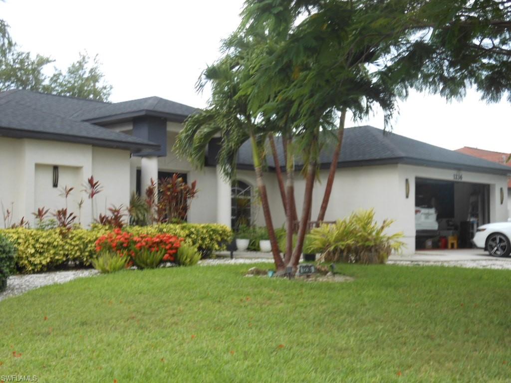 Welcome to 1236 Everest Pkwy, Cape Coral, FL 33904—a beautifully maintained 4-bedroom, 2-bath home with a 2-car garage, perfectly situated on a desirable corner lot in the heart of Cape Coral.

This property offers the ideal combination of comfort, convenience, and outdoor living. The spacious yard is a tropical paradise featuring an impressive variety of mature fruit trees, including mango, plum, loquat, avocado, and cherimoya, providing fresh fruit right from your own backyard.

Enjoy peace of mind with a newer roof (only 3 years old), city water and sewer assessments fully paid, and an irrigation system already in place. Even better, this home is located outside of a flood zone, helping reduce insurance costs.

Conveniently located just minutes from Del Prado Boulevard and Veterans Parkway, you'll have quick access to shopping centers, restaurants, schools, parks, and everything Cape Coral has to offer.

Whether you're looking for a family home, a seasonal retreat, or an investment opportunity, this move-in-ready property offers exceptional value in a prime location. Don't miss your chance to own this Florida gem!