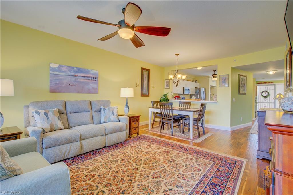 FIRST FLOOR Lely Resort Condo with sweeping LAKE VIEWS. PLAYERS CLUB OPTIONAL!! This stunning 2 bedroom plus den checks all the boxes.  New roof (2018), Newly painted interior (2021), New floors (2020), Newer appliances (2019), New driveway and walkway pavers (2019), Rebuilt toilets and new faucets in both bathrooms. Plantation shutters and closet doors throughout, with teak closet organizers in the luxurious walk-in closets. Upgraded screened lanai with tile gives you the perfect place to relax and enjoy the Florida weather as you look at the gorgeous lake.  A detached garage provides storage and 1 parking spot. The extra long driveway provides an additional 3 spaces. There are a lot of behind-the-scenes updates as well. Lely Resort is a few minutes from Marco, close to shopping, the beach, and beautiful 5th Avenue in Naples. There could not be a more beautiful place to live your Florida dream!!!!