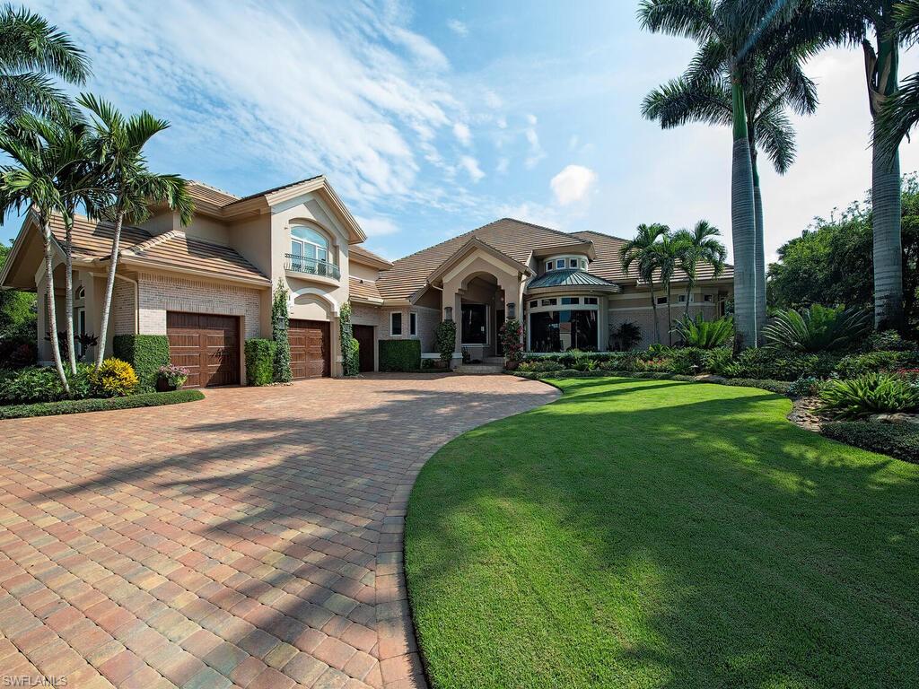 This beautifully appointed residence is a true marvel, having undergone a stunning transformation. Upon crossing the threshold of the custom front doors, you step into a light & bright living room adorned with intricately crafted ceiling details. Your gaze is immediately captivated by the panoramic vista of the pool, lanai, and serene expanse of the lake beyond.  Spanning over 5,000 SF of living space, this extraordinary abode boasts a masterfully designed kitchen that seamlessly flows into a comfortable great room, an elegant formal dining area, and versatile bar seating for casual dining or breakfast. Stepping out onto the screened lanai, you'll find an ideal setting for al fresco dining, relaxation in cozy seating enclaves, and use the outdoor BBQ for evening enjoyment. The owner’s suite offers a sense of opulence with its two expansive walk-in closets, the generous master bath provides double vanities, spacious walk-in shower, and sumptuous soaking tub. This home offers an array of amenities, including a fitness room, an integrated surround sound system, state-of-the-art security system, water treatment system, 3-car garage.  Whole-house generator and hurricane protection.