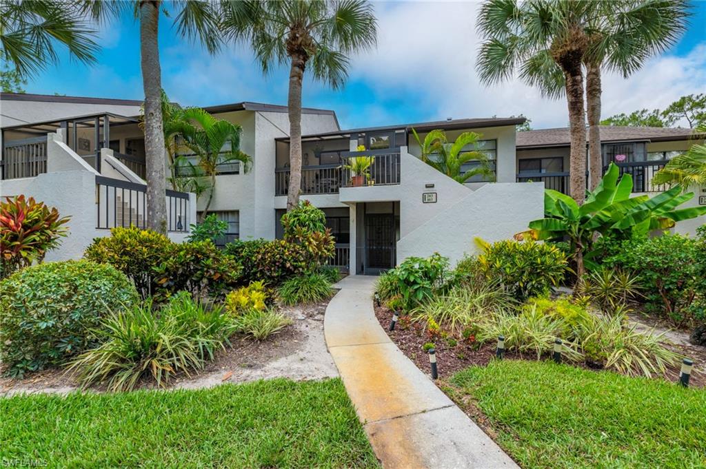 Exceptional value in this 2-bedroom, 2-bath condominium located just steps to one of the pools, in the highly desirable Hamptons at Kings Lake. Motivated seller has priced the property with future updates and improvements in mind.Offering tranquil landscaped and pool views from the spacious lanai, this residence combines comfort, convenience, and peace of mind. Enjoy relaxing outdoor living from the expansive 210-square-foot screened lanai, complete with a convenient storage closet, or unwind in the charming front porch seating area. The building is surrounded by lush, mature landscaping that reflects the pride of ownership throughout the community. Ideally situated just 4 miles from downtown Naples and 5th Avenue South, residents are minutes from world-class dining, shopping, entertainment, and Gulf beaches. Kings Lake Square is within walking distance, offering grocery stores, restaurants, and everyday conveniences. Residents also enjoy access to the scenic 1+ mile walking, jogging, and biking path surrounding Kings Lake.