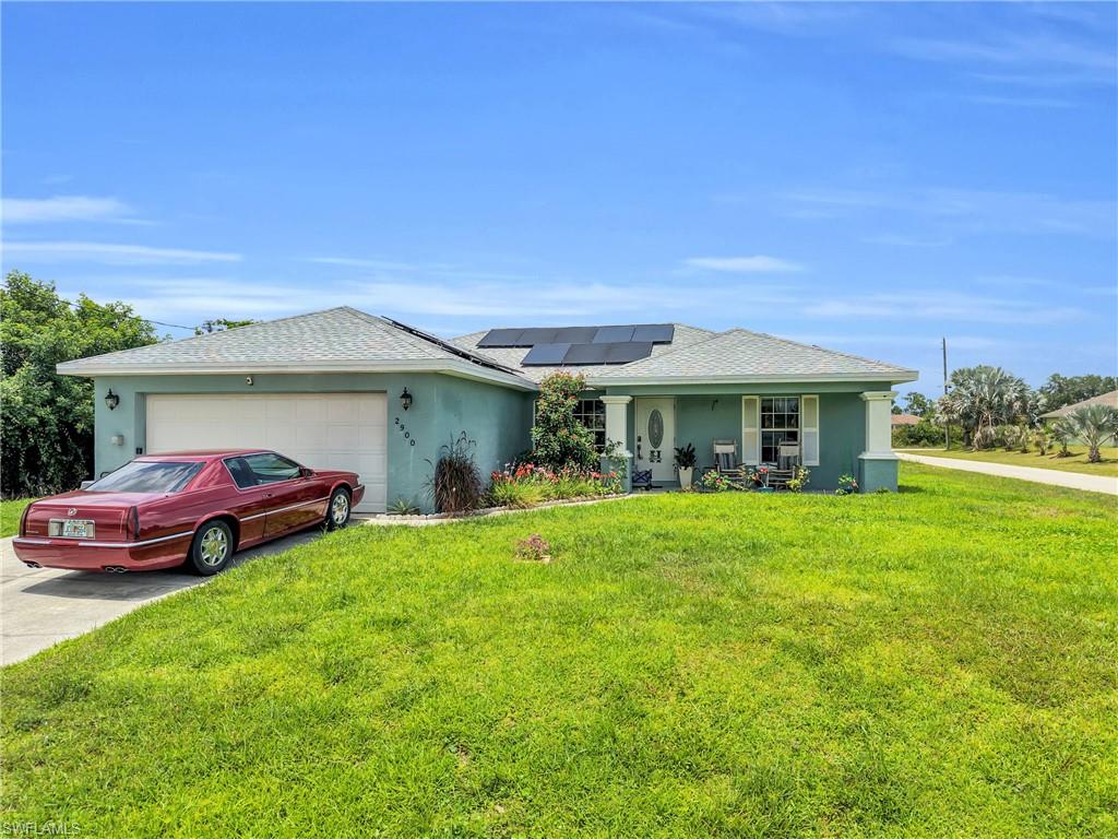 Well-maintained 3-bedroom, 2-bathroom corner home featuring a new roof installed in 2025 along solar panels for added value and energy efficiency. The open concept takes you to the kitchen which offers granite countertops, while the spacious screened lanai provides a comfortable outdoor living area. This home is an excellent opportunity for homeowners seeking comfort, quality, and long-term savings. Agents please read notes.