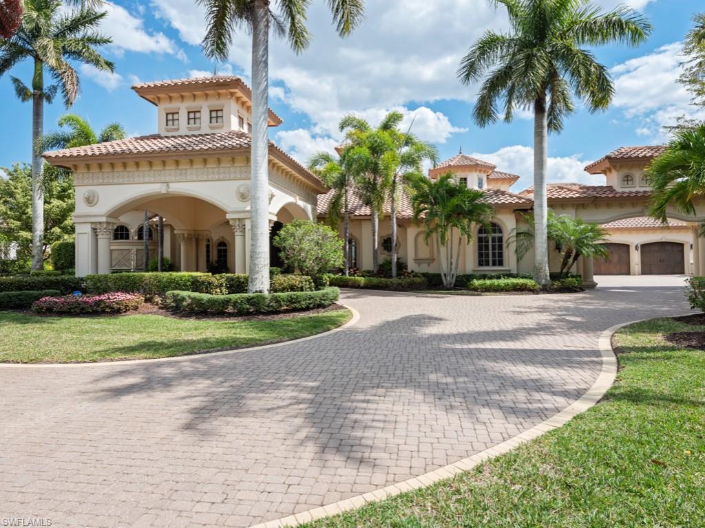 Sweeping panoramic waterfront views are the hallmark of this exquisitely appointed Grand Estate Home on the private peninsula of Isola Bella. With 238-feet of water frontage, this is one of the Miromar Lakes’ most iconic properties. The circular drive with a grand porte-cochere leads to impressive 13-foot custom wrought iron front doors. Inside, water views greet you in every room with the fine architectural details evident in the ceiling designs, spiral staircase, parlor room fireplace and game room with glass-walled temperature-controlled wine wall. Bespoke furnishings complement the natural stone floors, elegant chef's kitchen, office, and 3 spacious first floor en-suite bedrooms including the gracious main suite, and luxurious bath. Ninety-degree pocketing sliding doors lead to the private outdoor living space, with fireplace, custom salt-water pool and spa, and outdoor kitchen cabana overlooking the waterfront. The second floor encompasses a serene guest suite with den, and morning bar. French doors lead to an open-air waterfront veranda. Offered fully furnished, to enable a discerning buyer to immediately enjoy the luxury lifestyle of the #1 Community in the United States.