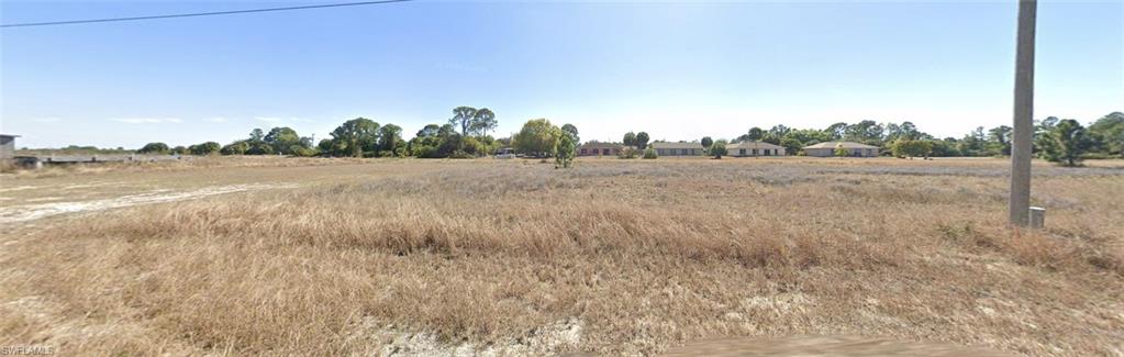 CLEARED lot no flood zone - Southern rear exposure -water view. This property is in a growing community in Lehigh Acres both privacy and convenience, with easy access to schools, shopping, dining, and major roads connecting to Fort Myers and surrounding areas. No HOA, no flood zone, and easy access to SR-82, and airport..