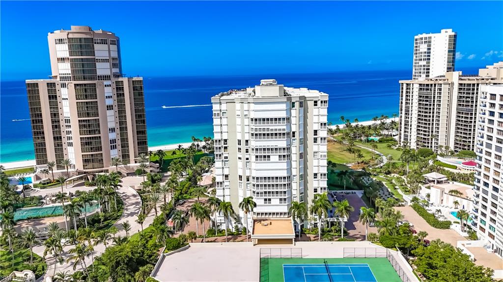 Experience the finest Naples beachfront living at the prestigious Monaco Beach Club. This fully renovated residence features 3 bedrooms, 2 bathrooms, and 2,265 sq ft of luxurious space. The open, split bedroom layout welcomes abundant natural light, showcasing stunning views of both the Gulf and Bay. High-end touches include custom cabinetry, Quartz countertops, Bosch appliances, designer lighting, and premium tile. The spacious kitchen seamlessly connects to the living and dining areas, creating an ideal setting for entertaining. The master en-suite boasts a walk-in shower, soaking tub, dual sinks, walk-in closet, and a separate sitting area. This exceptional unit is move-in ready and comes with designer furnishings. Monaco Beach Club, set on over 6 acres of prime beachfront property, is a premier building that features a beautiful lobby, fitness center, and hospitality room. Enjoy amenities such as a magnificent pool and spa, grill area, concierge service, covered parking, and 24-hour security with a manned and gated entrance. Residents also have exclusive access to the private Park Shore Beach promenade. Just steps away from the renowned dining and shopping of Venetian Village.