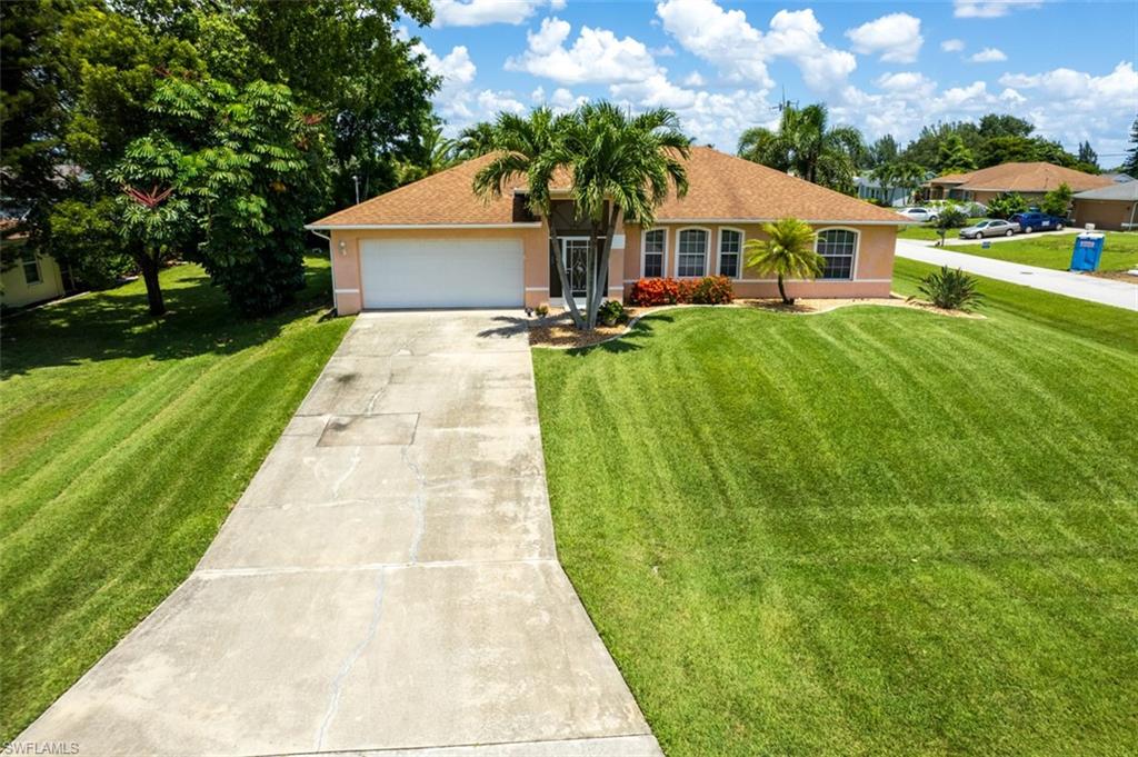 Nothing to do in this lovely 3 bedroom home with a large familyroom and open floor plan that makes it great for entertaining, Features include wood plank porcelain tile throughout, newer stainless appliances, newer A/C, and a fenced corner lot,  Other added bonuses include a new roof in August 2022, assessments are all paid and flood insurance is not required.