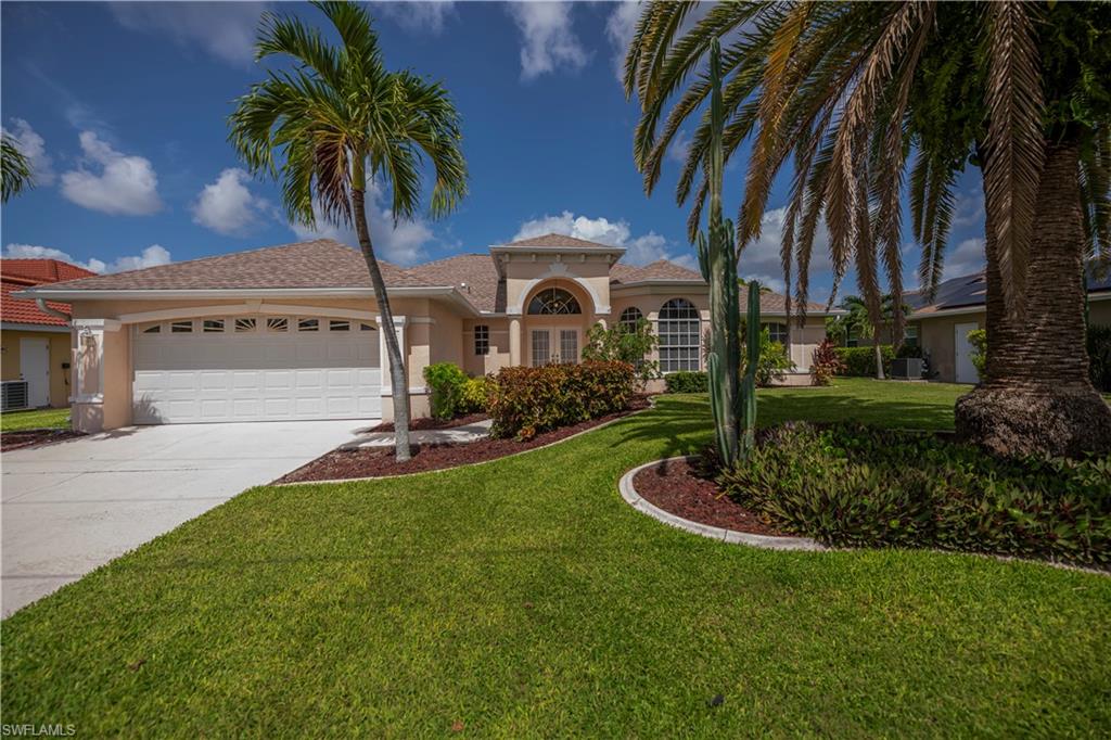 Located in the highly desirable Gold Coast Estates boating community, this beautifully maintained waterfront pool home offers approximately 1,744 square feet of living space with 3 bedrooms, 2 bathrooms, and direct Gulf access with no bridges to open water. Offering western rear exposure, this move-in-ready residence is being sold furnished and has never experienced flooding or water intrusion, providing peace of mind for its next owner.

The spacious split-bedroom floor plan features, an open living and dining area with soaring vaulted ceilings, tile and vinyl flooring throughout, and an inside laundry room. The home's thoughtful layout is ideal for both everyday living and entertaining.

The bright eat-in kitchen offers abundant cabinetry, a walk-in pantry, and opens seamlessly to the dining and family rooms, creating an inviting gathering space while overlooking the pool and lanai.

The spacious primary suite serves as a private retreat with direct access to the pool area, a large walk-in closet, and an ensuite bathroom featuring dual vanities, a garden soaking tub, and a separate walk-in shower. Two comfortably furnished guest bedrooms provide plenty of space for family and visitors, while the guest bathroom conveniently serves as a pool bath.

Outdoor living is designed to embrace the Florida lifestyle with a screened pool enclosure, heated swimming pool, covered lanai, spacious pool deck, and professionally landscaped yard perfect for relaxing or entertaining year-round.

Boaters will appreciate the exceptional waterfront amenities, including a large dock with Captain's Walk, a 7,000-pound boat lift, electric service at the dock, and quick access to open water. Located on the Lamb Canal, the property offers direct Gulf access with no bridges and approximately a six-minute boat ride to the Caloosahatchee River.

Recent improvements include a new roof (2026), air conditioning system (2024), and an updated pool heater.

Conveniently located with quick access to the Midpoint Bridge, the home is less than one mile from Horton Park Boat Ramp and Everest Marina, while also being close to shopping, restaurants, healthcare, golf courses, and Southwest Florida's world-famous beaches.