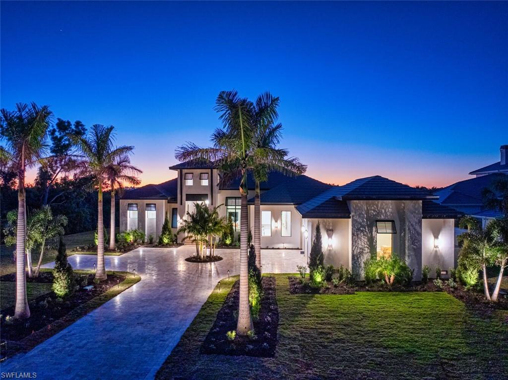 A Masterpiece of Organic Contemporary Elegance in Audubon Country Club. Welcome to an architectural triumph in the prestigious Audubon Country Club, where modern sophistication meets effortless natural luxury. Designed and built by award-winning PGI Homes, this brand-new custom estate spans 4,500 sq ft under air and over 7,000 under roof, offering four substantial en-suite bedrooms, a private study, and an ambiance of refined elegance. Located on a premium homesite, this residence boasts breathtaking sunset vistas over a lush nature preserve, providing a serene and private retreat. A grand foyer adorned with designer wall treatments and curated textures sets the tone for the impeccable craftsmanship found throughout. The open-concept great room, framed by floor-to-ceiling glass doors, seamlessly blends indoor and outdoor living. Soaring tray ceilings with custom detailing enhance the airiness, while warm European oak flooring adds to the home’s understated opulence. At the heart of the estate, the chef’s kitchen is a culinary masterpiece, featuring bespoke cabinetry, Sub Zero & Wolf appliances, and a stunning glass-enclosed wine display. Adjacent, a sophisticated private study with towering windows offers an inspired workspace or tranquil sanctuary. The primary suite is a haven of serenity, featuring luxurious textures, custom wood ceilings, and spa-inspired finishes. A seamless transition to the outdoor oasis reveals a truly resort-style (and resort size) pool, expansive sun deck, and multiple lounging areas, ideal for relaxation and entertaining. A fully equipped summer kitchen ensures al fresco dining at its finest. Additional highlights include an oversized garage with space for 4 cars, a whole-home generator for uninterrupted comfort, and exquisite designer finishes throughout. Situated in one of Naples’ most sought-after communities, Audubon Country Club offers championship golf, a newly reimagined clubhouse, tennis, and a vibrant social scene. Offered fully furnished, this is more than a home—it’s a statement of uncompromising quality and timeless sophistication.