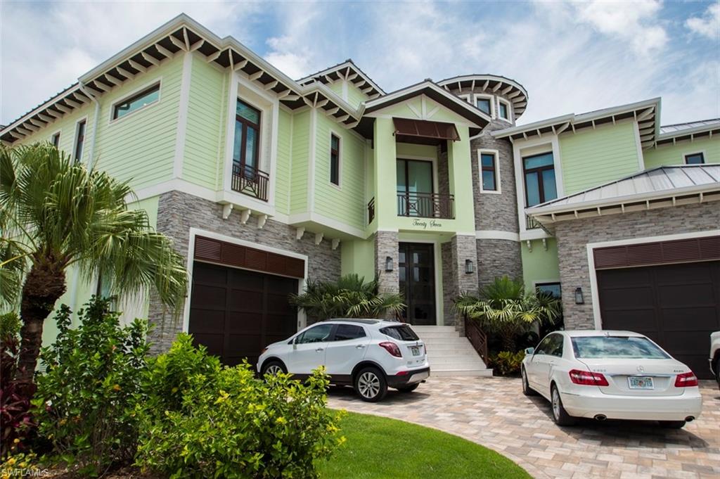 Stunning Bayfront Elevated Pool Home at the Waterfront entrance of the coveted development of Fairview Isles on Fort Myers Beach.