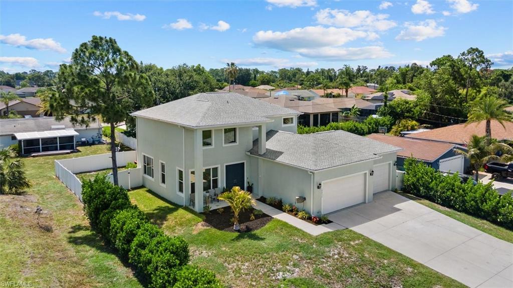RARE CUSTOM-BUILT TWO-STORY HOME in the heart of San Carlos Park! Unlike the typical homes found throughout the neighborhood, this one-of-a-kind residence offers an exceptional floor plan designed for today's lifestyle. Featuring 3 spacious bedrooms, a versatile den that can easily serve as a fourth bedroom, loft, and soaring volume ceilings, this home is filled with natural light and offers an open, airy feel from the moment you step inside. Thoughtfully designed with both comfort and functionality in mind, you'll find walk-in closets, dual vanities, abundant storage throughout, a private laundry room, water softener, and custom garage storage. The rare 3-car garage and oversized driveway provide parking for up to eight vehicles comfortably, making it ideal for families, guests, recreational vehicles, or extra storage. Upstairs, you'll find two additional bedrooms, a spacious loft, and a versatile den, offering endless flexibility to fit your lifestyle. Whether you envision a media room, game room, home office, guest retreat, or additional living space, the possibilities are endless. With its desirable western rear exposure, the second floor also provides the perfect vantage point to take in breathtaking Florida sunsets each evening. Step outside to your fully fenced backyard, where there's plenty of room to design your dream outdoor retreat with a custom pool, outdoor kitchen, playground, or entertaining space.

With NO HOA, you'll enjoy the freedom to truly make this property your own. Ideally located just minutes from Gulf Coast Town Center, Miromar Outlets, Florida Gulf Coast University, Southwest Florida International Airport (RSW), US-41, and I-75, this home offers the perfect blend of privacy, convenience, and accessibility. Combining custom craftsmanship, generous living space, and a versatile layout that is rarely found in San Carlos Park, this exceptional property is ideal as a primary residence, multigenerational home, or investment opportunity!