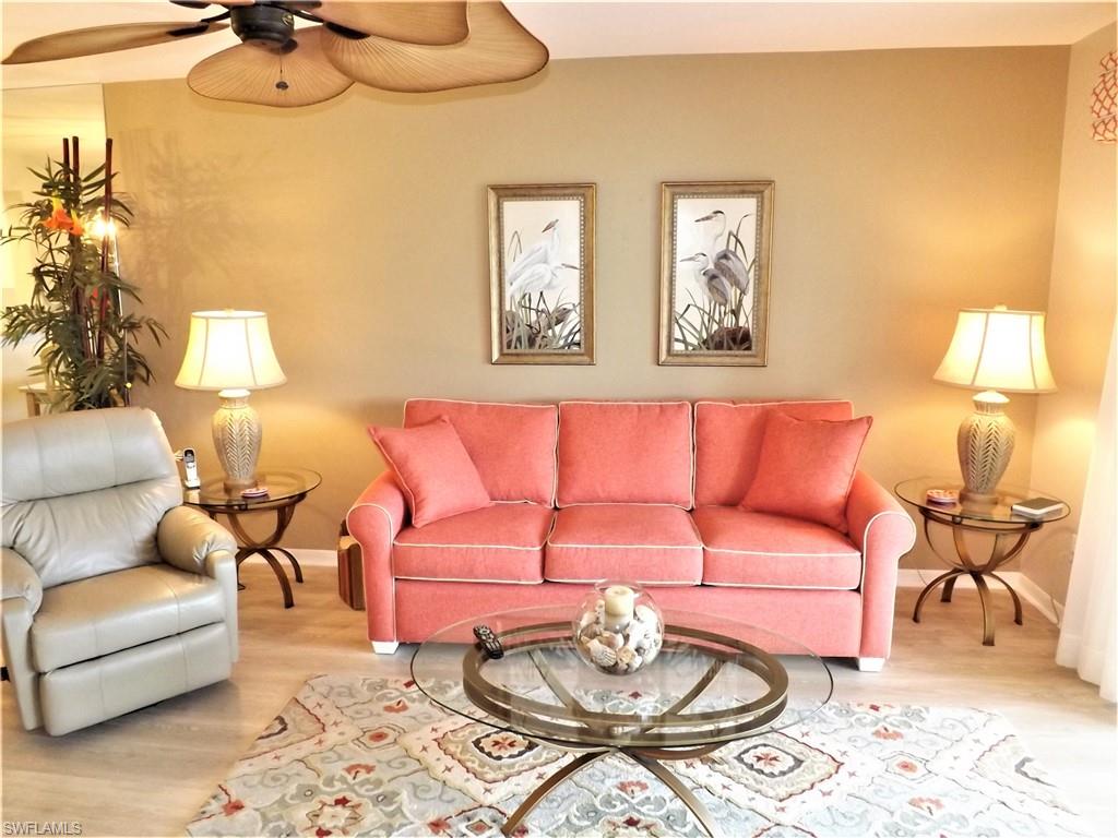 Make an offer!!!  SPECTACULAR “lakefront view from this turnkey, a move-in ready 1st-floor condo in the prestigious Kelly Greens Golf and Country Club community! This tastefully furnished and super clean 2 bed/2 bath unit is open, bright and ready for you and your suitcase. Highlights include updated kitchen, wood floors, neutral colors, 3x5 storage unit on both the lanai and carport, upgraded electric storm shutters, custom window coverings, tiled lanai, spacious walk-in master closet, carpet in bedroom and much more. The building was painted in 2019 and all condo assessments have been paid. Kelly Greens Golf and Country Club is one of the most desirable communities in SWFL! Kelly Greens is a fiscally sound, bundled golf community that includes a newly renovated Gordon Lewis Champion golf course, four Har-Tru tennis courts, updated full-service restaurant & grill and fitness center. The location is spectacular!!! Located minutes from Sanibel and Fort Myers beaches, Barbara B. Mann Center for the Performing Arts, shopping, hospital, dining and more.  Enjoy the fun & active lifestyle you deserve in a peaceful, serene setting!Call today for your private showing.