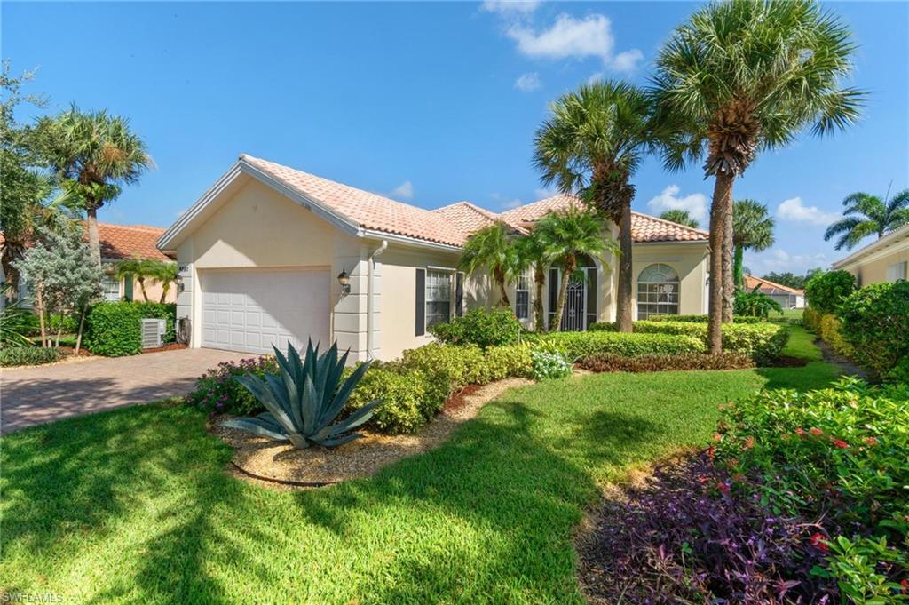 Welcome to the epitome of luxury living in the exclusive Island Walk Community of Naples. This stunning lake view pool home boasts 3-bedrooms, Den 2.5-bathrooms and a 2-car garage. Immaculate residence, showcasing the most sought-after floorplan, the Oakmont. Brand new air conditioning and pool heater installed in 2023. The den is a haven of sophistication, featuring custom wood built-ins that exude elegance. Unwind in luxury within the dual master baths, complete with tub and built-ins in the spacious closets. The kitchen includes granite countertops, white appliances, and ample storage space. Tile flooring complemented by crown molding and ceiling fans throughout the home. Step through the wall-to-wall glass sliding doors and immerse yourself in your own personal backyard oasis. The screened-in patio offers panoramic views of the sparkling lake and the inviting pool. Island Walk is renowned for its plentiful amenities including resort pools, restaurant, gas pumps, car wash station and much more providing residents with a resort-like experience. Don't miss the opportunity to call this stunning property your home and fall in love with the unparalleled luxury that awaits you.