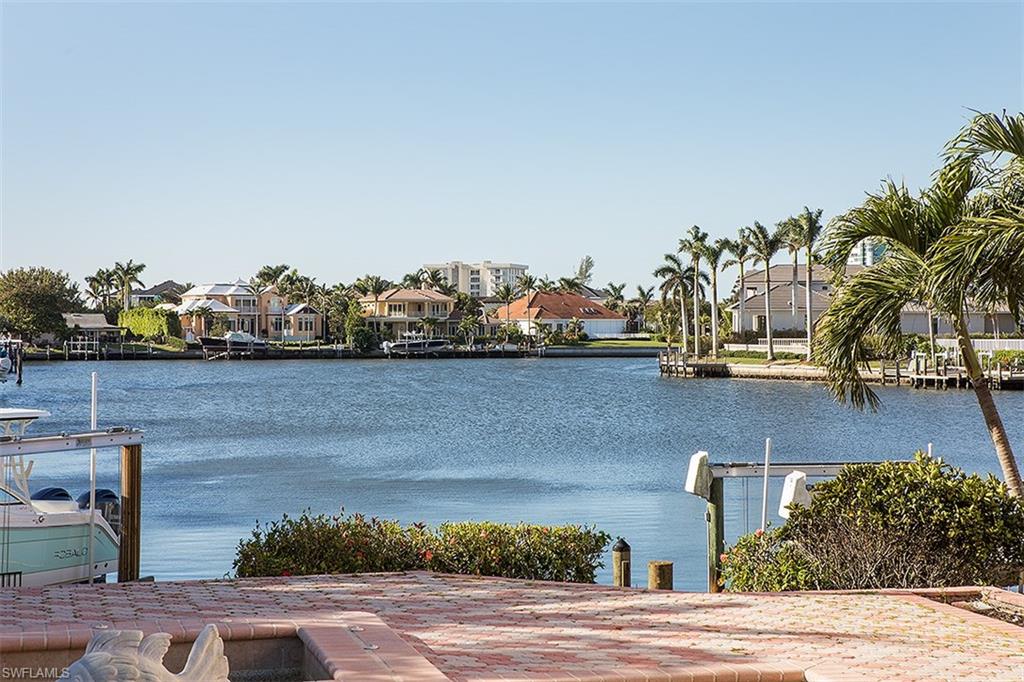 SELLER WILL ENTERTAIN BACKUP OFFERS. Spectacular waterfront offering in the heart of Park Shore, located along prestigious Neapolitan Way and within a short distance to the upscale shopping and dining venues of the Village on Venetian Bay and Waterside Shoppes. Offering long southwestern bay views, a newly constructed seawall and Gulf access, this .36-Acre property provides an exceptional building envelope for those wishing to construct a new premier waterfront estate. The existing 4-bedroom plus den pool home is well maintained and available for immediate occupancy. This property is also eligible for membership into the Park Shore Association, offering private beach access and beach parking to its members.  The improvements and/or structures on the Property are being sold in their "As-Is" condition.