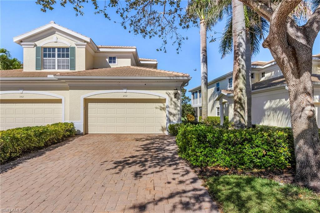 Stunning golf course and sunset views await you. This bright, spacious, (over 2500 square ft) second floor coach home with private elevator has it all including access to immediate golf membership! Skip the waitlist and start enjoying one of the areas most desirable clubs today. Home features include new 5 ton Trane two stage ac (2022), rheem water heater (2023), 20/20 lanai screen with rc-controlled hurricane protection allowing privacy and ultimate comfort for indoor/outdoor enjoyment. All windows covered with 3m film to help block uv. The garage floor has been professionally epoxied & custom cabinetry installed by encore garage. Home is being sold furnished. All Palmira residents have access to the newly remodeled RCC center with a state of the art gym, resort and lap pools, tennis ,pickleball, bocce and so much more.