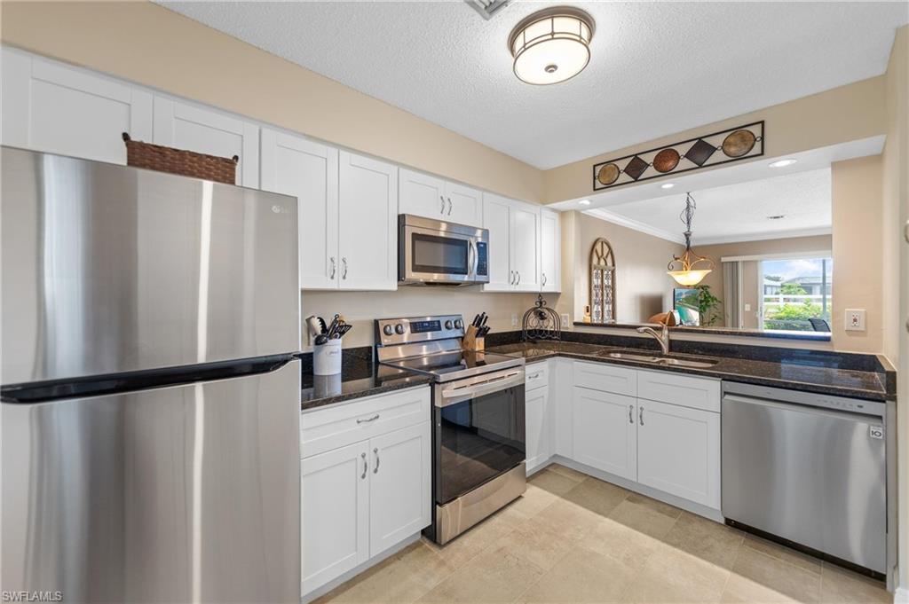 Enjoy peaceful lake views and effortless Florida living in this beautifully updated furnished townhome featuring two spacious primary suites. Designed with charming Olde Florida style architecture, this light and bright home offers an open concept floor plan with upgraded luxury vinyl plank flooring on the main level and laminate flooring throughout the bedrooms. The upgraded kitchen features white wood cabinetry, granite countertops, stainless steel appliances, and overlooks the spacious great room, where oversized triple sliding glass doors open to a covered screened lanai with picturesque lake views. Upstairs, both generously sized bedrooms are en suites with private baths, making this an ideal layout for guests, roommates, or seasonal living. One suite features a walk in shower, while the other offers a tub and shower combination, and one suite includes its own private screened lanai overlooking the lake. A convenient half bath and laundry room are located on the first floor. Relax from either of the two screened lanais while enjoying the tranquil waterfront setting. Residents of Cypress Plantations enjoy a community pool, scenic walking and biking paths, and an unbeatable Bonita Springs location just minutes from Downtown Bonita Springs, Coconut Point, dining, shopping, entertainment, and the area's beautiful white sand beaches. Offered furnished, this move in ready home is ready for you to start enjoying the Florida lifestyle from day one. Schedule your private showing today.