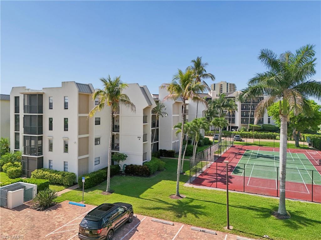 Welcome to a stunning gated condo located in the highly desirable South End of Marco Island. This beautifully maintained unit has spacious living areas with abundant natural light. This condo has three bedrooms and three bathrooms. Each bedroom is a suite with it's own full bathroom.The modern kitchen is bright and airy with ample storage. Relax on your two private lanais and enjoy the coastal breeze. The community features a pool, tennis courts, pickleball, boat docks which are available, motorized kayak lift,  bike storage, chicky hut with tables and barbecue grill.  Property and pool sit directly on Caxambas Pass.  Tile throughout the unit, A/C 2019, hot water heater 2024. Electric and manual storm shutters on all openings. Embrace island living with nearby shopping, dining, and pristine beaches. Pets allowed.