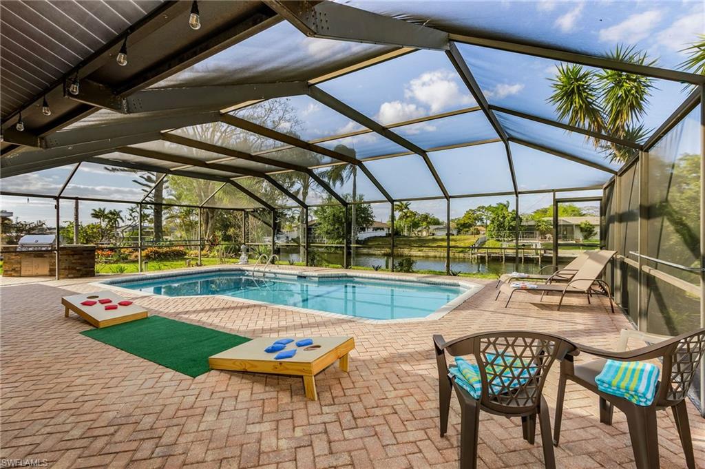 This is a VACATION RENTAL only. Owner will not consider annual rentals. Weekly rentals are welcome.
Villa Mahana is a 3-bedroom, 2-bathroom property with an electric-heated saltwater pool on a gulf access canal. This home sleeps a maximum of 8 guests (including children) and is not pet friendly.

· · · · · PROPERTY PERKS · · · · ·
- Outdoor kitchen
- Outdoor games
- Saltwater pool

· · · · · LOCATION · · · · ·
- Located in Southeast Cape Coral
- Close to Horton Park & Boat Ramp
- Close to Midpoint Bridge, which leads to Fort Myers/Fort Myers Beach
- A short drive to Veterans Park, where you can see burrowing owls!

· · · · · LIVING AREAS · · · · ·
- Flat-screen TV
- Comfortable seating
- Additional sitting area off kitchen with view of the pool

· · · · · KITCHEN & DINING · · · · ·
- Fully equipped
- Dining area with seating for 6

· · · · · BEDROOMS · · · · ·
- Primary Bedroom: Queen bed & new flat-screen TV (not shown)
- 2 Guest Bedrooms: Queen beds in each, one with sliders to the pool

· · · · · BATHROOMS · · · · ·
- Primary Bathroom: Shower only & single sink vanity
- Guest Bathroom: Shower/tub combo & doubles as the pool bathroom

· · · · · OUTDOOR LIVING · · · · ·
- Electric heated saltwater pool
- Northern pool exposure
- Outdoor kitchen with grill
- Dining area with seating for 4
- TV on lanai
- Sun loungers
- Concrete dock - fish or watch for marine wildlife!

· · · · · THIS HOUSE IS GREAT FOR · · · · ·
Families looking for a home with lots to do