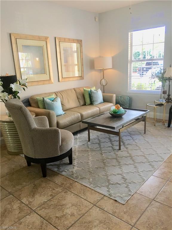 Highly sought after 1st floor. Western exposure updated corner 2 bedroom & 2 bath condo. Completely updated & professionally decorated. All new kitchen appliances 11/17, new air conditioner/furnace 3/18, water heater 11/16, new carpet in both bedrooms 2018, tile in all living areas & bathroom, granite kitchen counter tops, white kitchen cabinets, fresh neutral paint color throughout, new master bathroom vanity 2018. Laundry in unit. Great open floor plan, ample closet space & a deluge of natural light from the lanai & windows. The Tides at Pelican Landing is conveniently located to beautiful beaches and all the shopping, dining & entertainment of Coconut Point Relax around the sparking resort style pool, enjoy a game of tennis, pickleball, basketball & sand volleyball, workout in the fitness center, stroll through the peaceful parklike grounds & lounge in the expansive community room. The Tides @ Pelican Landing is conveniently located to beautiful beaches & all the shopping, dinning & entertainment of Coconut Point. 15 minutes to RSW airport. Across the street from the new state of art Lee Memorial Hospital.