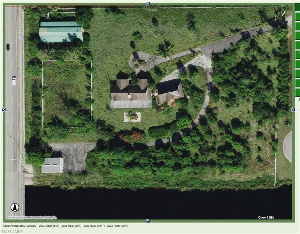 Very Unique Estate centrally located 10 minutes from the Beaches, Downtown 5th Avenue and the Naples Airport.  Comprises of 8.15 Acres, including easement and Canal.  The existing Acres may be sub-divided into
three separate lots for three separate homes.  The land now consist of, and includes, A spacious main residence, 10 stall horse facility, 30 x 40 metal building, 4 car garage with adjoining one bedroom apartment above.  All of these structures have been idle, and vacant for a few years and are in need of repair and renovation.  One may also choose to remodel the present premises or build an entirely new resident.  The possibilities for this property are endless.  The property boundaries allow for a very private lifestyle, located on a cul-de-sac, at the end of the street. There is over 600' of canal frontage to the south, vacant lot to the north, Livingston rd. to the west. There is no through traffic, and it is easily accessible  from the main road.  If desired, the property would make a terrific economical investment opportunity for those who may wish to speculate for future zoning and development in this prime S.W. Florida location.  Sold " As Is" to right to inspect.