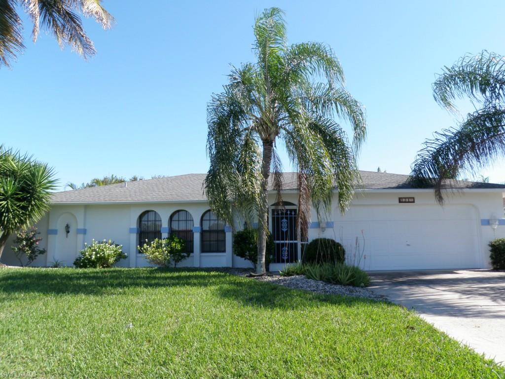 Lovingly maintained newer 3/2 home in the heart of SE Cape Coral close to shopping, hospital, schools & EVERYTHING. The screened entrance opens to the split layout featuring immaculate separate living, family & dining rooms. Master suite includes bath, walk in closet, built in vanity & sliding glass doors leading to the finished Florida room. The guest suites share a bath that opens to the Florida room for added convenience. The Florida room features wood-like flooring, sliding glass doors to the back yard area & would make an awesome game/play/sewing/TV room but is currently being used for storage.  The rear of this home is lush and full of fruit trees including lemon, banana & orange. Get a head start on your garden as the rear length of the property is full of tomatoes, peppers and the like.  Notables: Built with energy efficient Good Sense Package, 2013 freshly painted exterior, NEW washer & hot water heater, 2012 entire home was repiped, 2005 new roof installed.  ASSESSMENTS IN & PAID! See virtual tour!