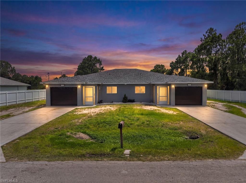 Excellent investment opportunity in the growing area of Lehigh Acres! Recently remodeled, NEW roof, newer AC, Aluminum fence, Impact garage doors, and much more. This well-maintained duplex offers two spacious units, each featuring comfortable living areas, functional kitchens, generous bedrooms, and one car garages each. Whether you're looking to expand your investment portfolio or live in one unit while generating rental income from the other, this property is an outstanding choice. Conveniently located just minutes from 82, with easy and fast access to I-75, near schools, shopping, restaurants, parks, and major roadways, providing easy access to Fort Myers and surrounding areas. Lehigh Acres continues to experience strong growth, making this duplex an excellent opportunity for both investors and owner-occupants. Don't miss your chance to own an income-producing property in one of Southwest Florida's fastest-growing communities!