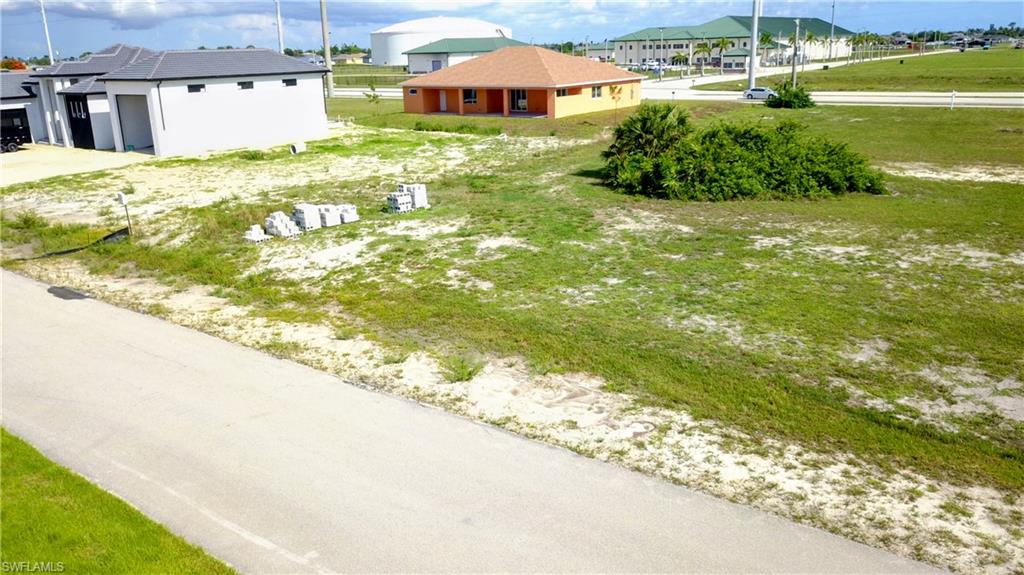 Build your dream home on this beautiful 1/4-acre vacant lot in Cape Coral! Located in a great neighborhood,
this property offers an excellent opportunity to invest in one of Southwest Florida’s most desirable areas.
Situated across the street from waterfront properties, you’ll enjoy the feel of a premium location without the
waterfront price tag. The surrounding area features well-maintained homes, peaceful streets, and convenient access to shopping, dining, schools, parks, and everything Cape Coral has to offer. Whether you’re ready to build now or looking to secure land for the future, this lot is a fantastic option in a growing community. Don’t miss your chance to own a piece of paradise in Cape Coral!