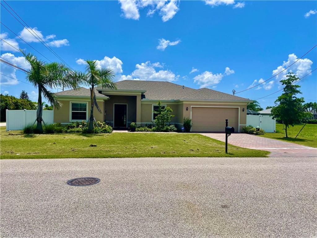 Practically New! Why wait for new construction, this one is ready to move in! One year old Three bedroom plus Den Signature home. New pool project recently completed with electric heater, salt water system, sun shelf with water features, and plenty of outdoor living space! Extra pavered area outside of pool screen enclosure with a propane fire pit. Oversized corner lot with six foot privacy fencing with large double door entry and plenty of room to park your boat in the backyard. Open concept with large Island kitchen, beautiful granite countertops, pantry, and lots of cabinet space. Large master bedroom has his and her walk-in closets. This home is in the very desirable Southwest section of Cape Coral. Act now before this one is gone!