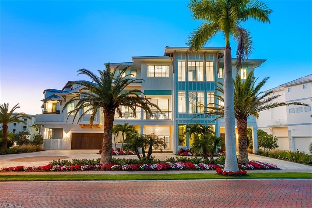 Wake up to waves & end every day with a sunset. Designed and constructed by Sea Castle Development & Ashmore Design, this beachfront residence stands as a premier architectural statement in one of Southwest Florida’s most elite enclaves. With 4,676 square feet of refined, conditioned interior space and just under 4,000 square feet of elevated outdoor living  space, this trophy residence delivers uncompromising luxury, innovative engineering, and sweeping panoramic views of the Gulf of America. Upon reaching the main living level, panoramic views of white sand and turquoise water immediately define the space. An open floor plan connects the dining area, kitchen, great room, and bar, all flowing onto an expansive covered lanai and sun deck surrounding the elevated pool and spa with a negative edge overlooking the beach. Each room incorporates custom ceiling or wall treatments—beams, tongue-and-groove, millwork—paired with premier quality craftsmanship. A floating staircase with wide wood illuminated treads and serves all three levels. Designed for those who demand the extraordinary, every finish, system, and structural detail was curated to exceed luxury-home standards while embracing a modern coastal aesthetic.