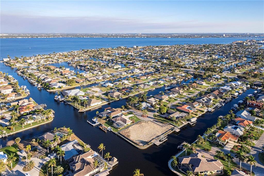 Rare opportunity to own over half an acre on intersecting canals, delivering expansive water views and unparalleled design flexibility. This oversized homesite invites you to build a custom waterfront estate without limitations of a traditional lot, where your vision can come to life.