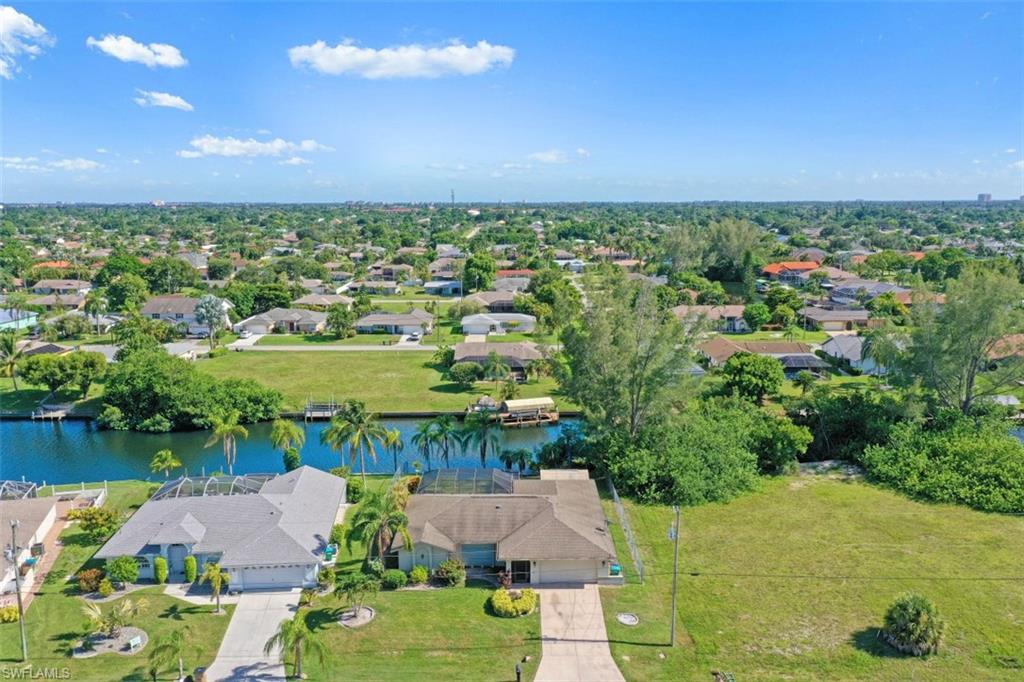Gulf Access Sunny Southern Exposure Pool Home! Plenty of room in this well maintained 3 Bed 2 Bath home. Step into the foyer area and see the living and dining area wrapping around to the left meeting the bright and roomy kitchen with plenty of cabinets and counter space. Just beyond the breakfast bar brings opportunity to create a cozy eat-in kitchen atmosphere leading to a family room just waiting to host holiday gatherings. Sizable owners suite with walk-in closet and private bath provides sliding door entry to the screened lanai. Two additional bed rooms and full bath, which also acts as a pool bath available. Enjoy Florida sunny days relaxing within the screened pool/lanai area or seek adventure coasting the canals out to the Caloosahatchee River which will lead you to the open waters of the Gulf with breathtaking sunsets, beaches and great fishing. Private concrete dock just waiting for your very own lift to be installed hosting your dream vessel. Fenced yard, ideal for the four legged family members & shed providing additional storage space. Located in a tucked away neighborhood you are still close to a variety restaurants, shopping, parks and more. Come take a look!!