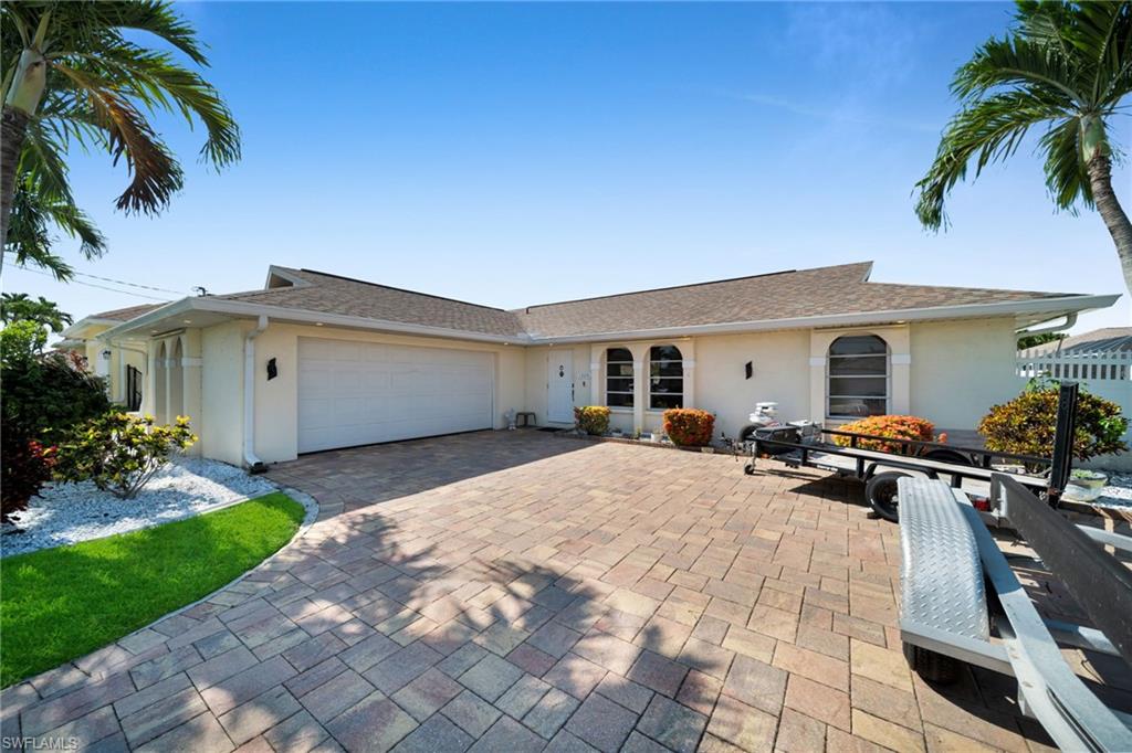 Beautiful property located in a very desirable area. This 3 bed/2 bath, pool home offers the opportunity to enjoy what residents proudly called "Cape way of life". This property's proximity to main attractions such as Tarpon Point, Cape Harbour, cafes, and restaurants makes it very convenient. 
The open floor plan with and 2 sets of pocket sliders, allows views to the southern exposure pool area. The home has been remodeled including new Kitchen cabinets, bathrooms, new ceiling fans and new light fixtures in every room. Other features include hurricane shutters, pool heater plus salt water system. Newer AC system, garage has it's own separate A/C and the driveway has been widened with new pavers and a path to the pool and fenced back yard area. It also offers a 50 Amp car charging outlet and hookup for a portable generator up to 50amps with a concrete pad. This is a must see!