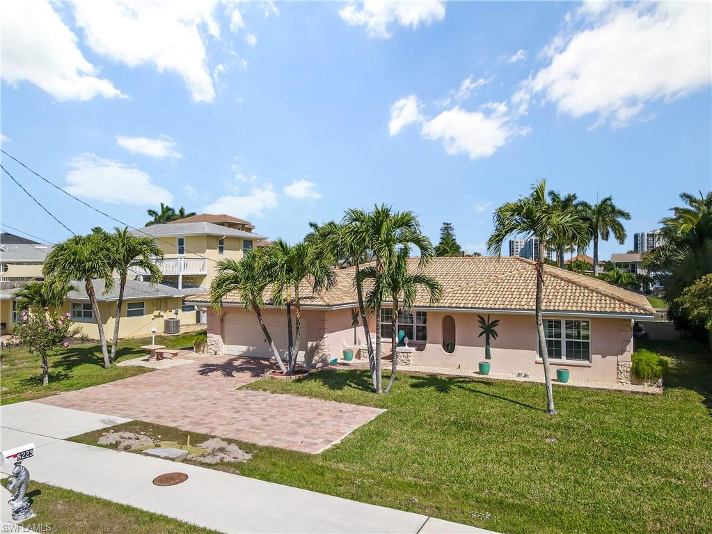 WEEKLY INCOME POTIENTIAL - BOATERS DREAM - BEACH LOVERS DREAM!! Direct GULF ACCESS. 5 Minutes to Big Carlos Pass and out on the Gulf of Mexico. 2 BOAT LIFTS. Walk across the street to the BEACH or BOAT to the GULF of Mexico in MINUTES. This single family 2 bed + Den 3 Bath Heated POOL home is in the highly desired Laguna Shores Community. TILE FLOORING throughout the house. This home has 1824 square feet of living space with HUGE INVESTMENT INCOME potential Weekly 7 Day minimum rental up to 52 weeks a year. 2 outdoor storage sheds for outdoor toys. This home has is it all! This home is priced to sell and can close quickly. Please allow 48-hours to review all offers.