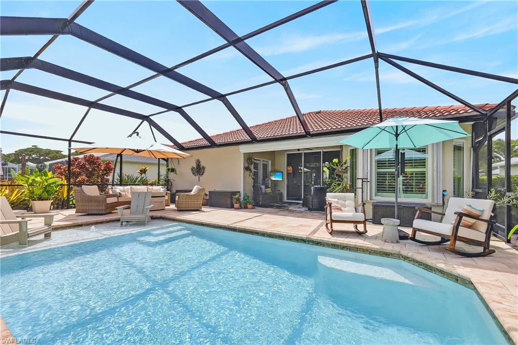 Wow! This is the Florida lifestyle you have been waiting for! Welcome to this beautifully renovated two bedroom plus den, two bath pool home in the highly sought after Heritage Cove 55+ Community. The showstopper is the spectacular heated saltwater pool with panoramic picture window screen enclosure offering wide open views and an incredible outdoor living space! Surrounded by a paver deck and enhanced with landscape lighting, this private oasis is perfect for relaxing, entertaining, and enjoying Florida living year-round. Step inside and you’ll immediately appreciate the extensive upgrades and attention to detail. The designer kitchen features custom cabinetry and hardware, gorgeous quartz countertops, updated appliances, and a newer air fryer oven. Porcelain tile flows throughout the home, complemented by plantation shutters, recessed lighting, and stylish Minka-Aire ceiling fans. Both bathrooms have been beautifully renovated, including a luxurious primary bath with a tiled shower and relaxing soaking tub. The cozy den features a stunning electric fireplace, adding warmth and character to the space. Major improvements include a 2025 AC, 2025 double pane E-glass windows, and a 2024 hot water heater. The updated laundry room offers matching cabinetry, space for your coffee bar, newer high-end washer and dryer, and a laundry tub. The garage is equally impressive with an epoxy floor, motorized screen, ceiling mounted storage racks, and a Culligan water softener. From the stained glass front door to the paver driveway this home has been thoroughly improved from top to bottom. Be sure to explore the virtual 3D Matterport tour for an immersive walk-through showcasing all of the fabulous upgrades and special features this exceptional home has to offer! There was no flooding in the home from any of the hurricanes. Heritage Cove offers low HOA fees, and fantastic amenities, including a resort style pool, clubhouse, tennis, bocce ball, shuffleboard, fitness center and more. Also many indoor activities, such as bingo, mah-jongg, poker, and bridge. Pets are welcome here too! The community is close to Sugar Sand Beaches, Restaurants, RSW Airport and Shopping! Super low HOA fees and no CDD make Heritage Cove a fantastic place to live! Pack your bags, this one is ready to enjoy! Don’t miss your chance to own this fabulous home in Heritage Cove. Schedule your showing today!