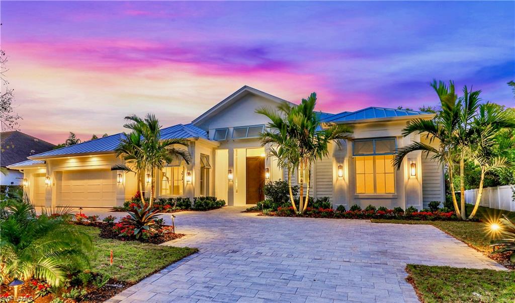 Introducing a stunning new construction home in the heart of Coquina Sands that pairs timeless design with the highest quality construction.  Located on picturesque Coral Drive, with its beautiful canopy of Mahogany trees, this inviting coastal home takes maximum advantage of natural light from every exposure. Built by Dillman Construction, one of Naples premier luxury builders, the one level plan includes generous open spaces, perfect for entertaining. The plan also offers a gorgeous primary suite plus a 2nd oversized suite & 2 more spacious bedrooms, providing the utmost in flexible living. Luxury finishes throughout, incl. Legno Bastone European oak floors, & extensive custom wood trim & wainscoting.  Other features include Sub Zero & Wolf appliances, hidden walk-in pantry & a/c garage storage. Amazing outdoor area with a 42-foot lap pool & spa, waterfall, fire features & sunshelf.  There's also an expansive outdoor living area & kitchen, linear gas fireplace, pool bath, outdoor shower & electric screens & shutters.  All complimented by a coral stone pool deck & ample yard space for your outdoor activities. Located minutes to Lowdermilk Beach Park & the new Four Seasons Resort.