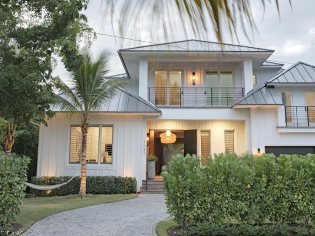 Another masterpiece designed and built by Griffin Builders is now available in Olde Naples, featuring a collaboration of quality craftsmanship and a French Indies design inspired by St Barth’s.

Fully-furnished, this home includes five bedrooms, plus a den, five full bathrooms, and two half bathrooms in its 4,771 square feet under air, as well as a clean and fresh exterior design, natural wood elements that flow throughout the space, and exquisite furnishings delivered from Paris, France, including custom designed drapery. 

The master bedroom has a St. Barth’s island villa feel with a spa-like master bathroom and a craft room/workshop features custom cabinetry by California Closets. There is also an abundance of storage space throughout the home.

Expansive sliding glass doors lead you to an impressive outdoor living space perfect for al fresco dining and entertaining with bar and island seating, outdoor kitchen table seating, and additional outdoor living space seating. Your private and quiet backyard oasis has a pool and spa that seats 8-10 people.

Contact us to schedule your tour of this one-of-a-kind St Barth’s-inspired home.