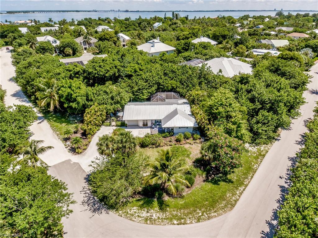 NO HOA's, overcrowded community pools, or high rental activity from the neighbors. Welcome home to this quintessential Sanibel Charmer located on the desirable East End of the island! Walk to the beach, fish the Sanibel Pier, bike to “Old Town Sanibel “ and enjoy all of the conveniences of East End living! 1114 Sabal St. is a remodeled ground level 2 bedroom 2 bathroom pool home that is cute, very comfortable, and has room to grow. The home is situated on a beautifully vegetated corner lot nearly a 1/2 acre in size and is just a quick stroll to the neighborhood’s boardwalk beach access. This home has been meticulously updated and tastefully decorated exuding the island charm and lifestyle. New Metal Roof and all new electrical in 2017. New beautiful wood plank flooring, irrigation system, impact windows, pool heater, and brand new entrance and deck in 2019. Easy island living in this ground level near beach home that embodies the Sanibel Style, shows wonderfully, and is ready for its new owners to enjoy.