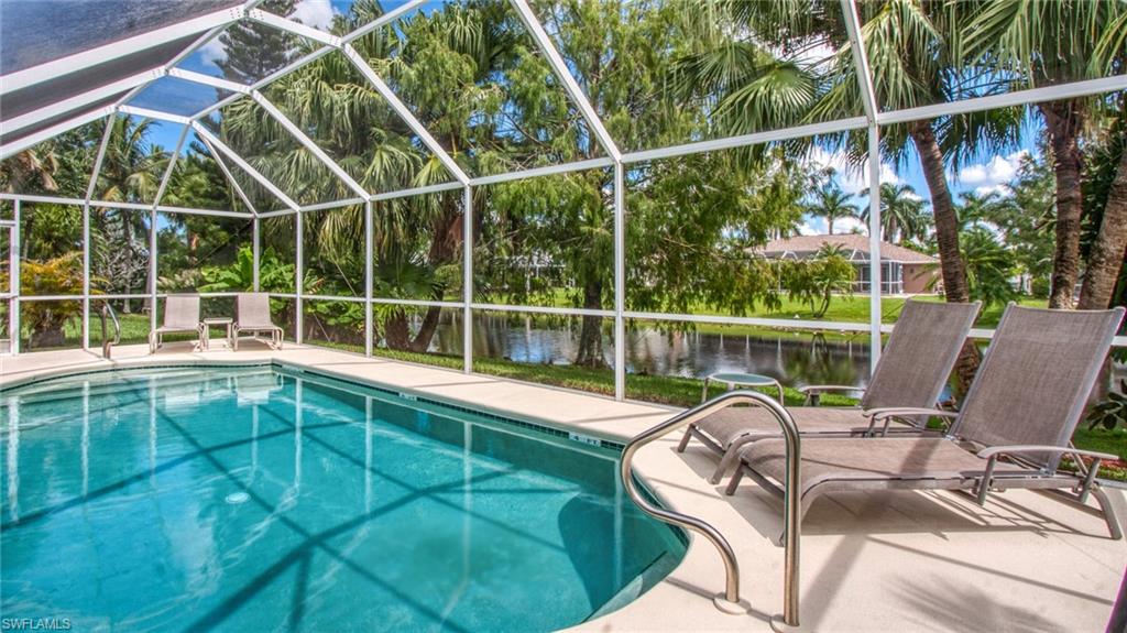Peaceful. Fantastic Rose Garden location, park-like backyard on a pond. Front yard is almost as good; landscaped area on the other side of the road, no buildings. Walking distance to restaurants and marina of Tarpon Point. Side walk and bicycle lane. -- Built 1998, high ceilings, 2073 sq. ft. air-conditioned living area, 3 bedrooms, 2 full bathrooms, 1 pool or guest bathroom. Several updates. Floors tiled throughout. New kitchen fronts, granite counter tops and stainless steel sinks. New walk-in shower in guest bath (frameless glass). Currently participating in the vacation program. Fully furnished and equipped. Hurricane shutters.