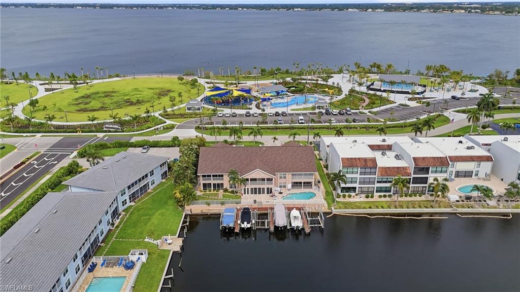 Experience the ultimate Cape Coral waterfront lifestyle at this Beautiful Turnkey Condo! This exceptional residence offers water on both sides, direct Gulf access, an included 10,000-pound boat lift, and a full-size one-car garage—a rare and highly desirable combination.

Well maintained by meticulous owners, the unit is located in a beautiful, intimate waterfront community directly across from the brand-new Jaycee Park. Simply walk across the street to enjoy the park and its waterfront amenities or take a quick trip to downtown Cape Coral’s restaurants, shopping, and entertainment.

Boaters will love the effortless access to the water, while everyone will appreciate the peaceful views, unbeatable location, and exceptional pride of ownership. Waterfront living, boating convenience, garage parking, and one of Cape Coral’s most exciting new parks right outside your door this incredible unit truly has it all!