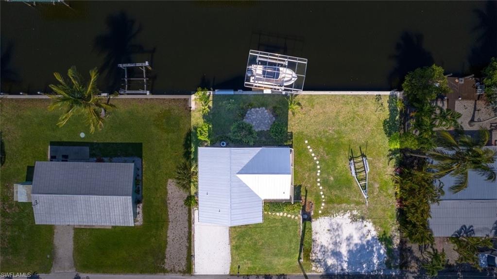 This is the perfect spot to build your DIRECT GULF ACCESS island home! This cleared waterfront lot comes with a solid 2015 seawall already in place, offering the perfect setting for boating, fishing and kayaking. Nestled in a peaceful and friendly island community just steps from Jug Creek Marina, you’ll enjoy the tranquility of coastal living. With no bridges to the Gulf, you can set sail with ease to world-class destinations like Charlotte Harbor, Cayo Costa, Boca Grande Pass, Cabbage Key, Sanibel, and Captiva. Whether you're seeking adventure or relaxation, this location provides the best of both worlds—secluded beaches, waterfront dining, and the wide-open beauty of the Gulf of Mexico just moments away.